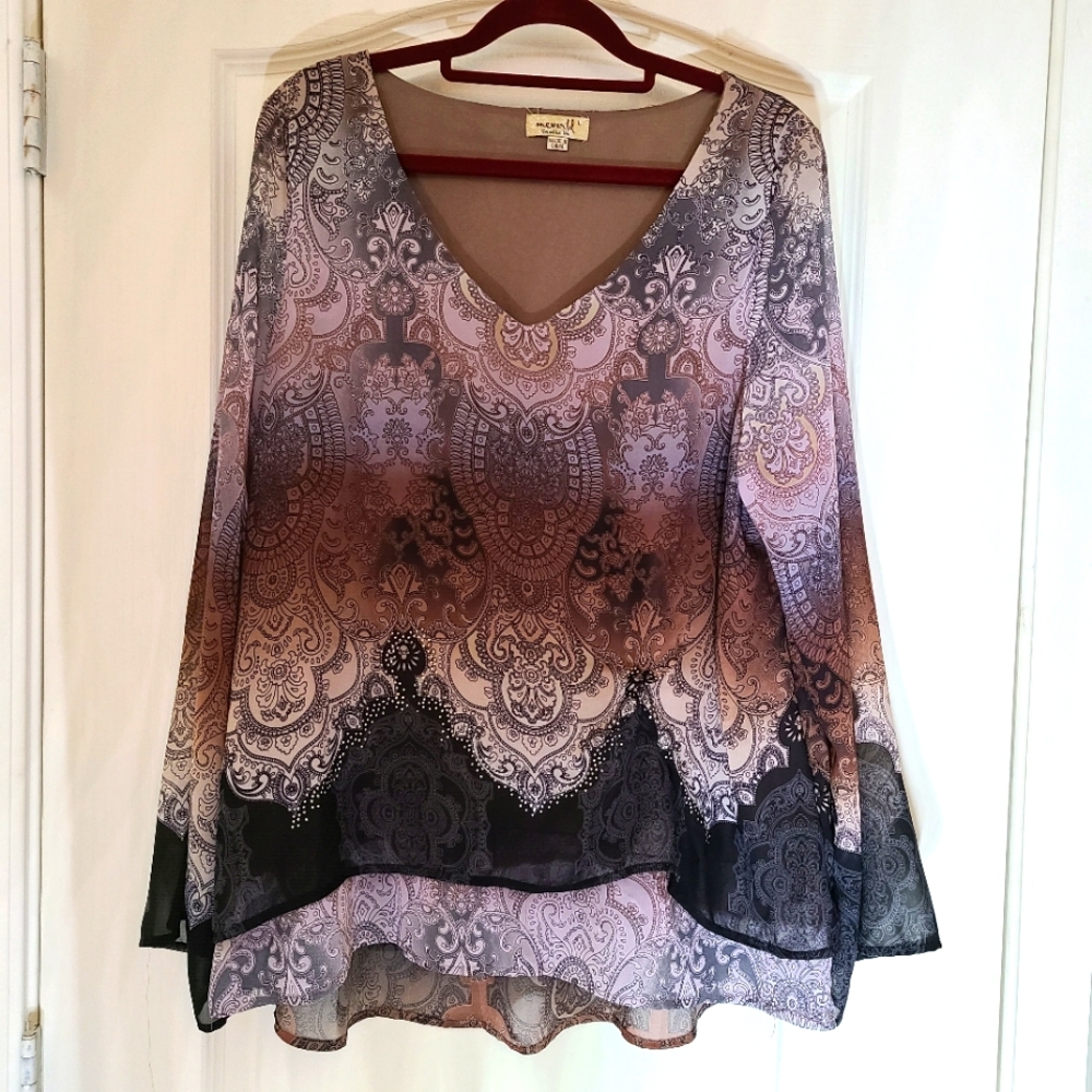 Beautiful long sleeve silky blouse with lining and rhinstones.